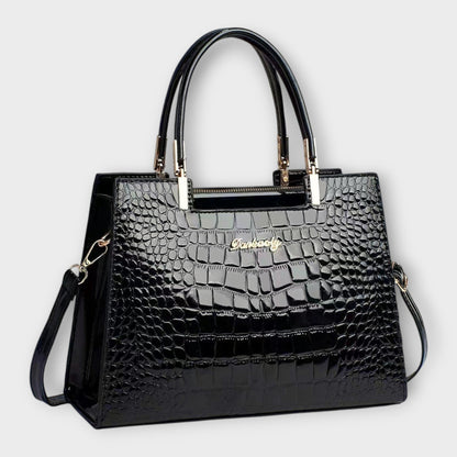 Bolso de mano brillante con estampado de piel de cocodrilo de Laura