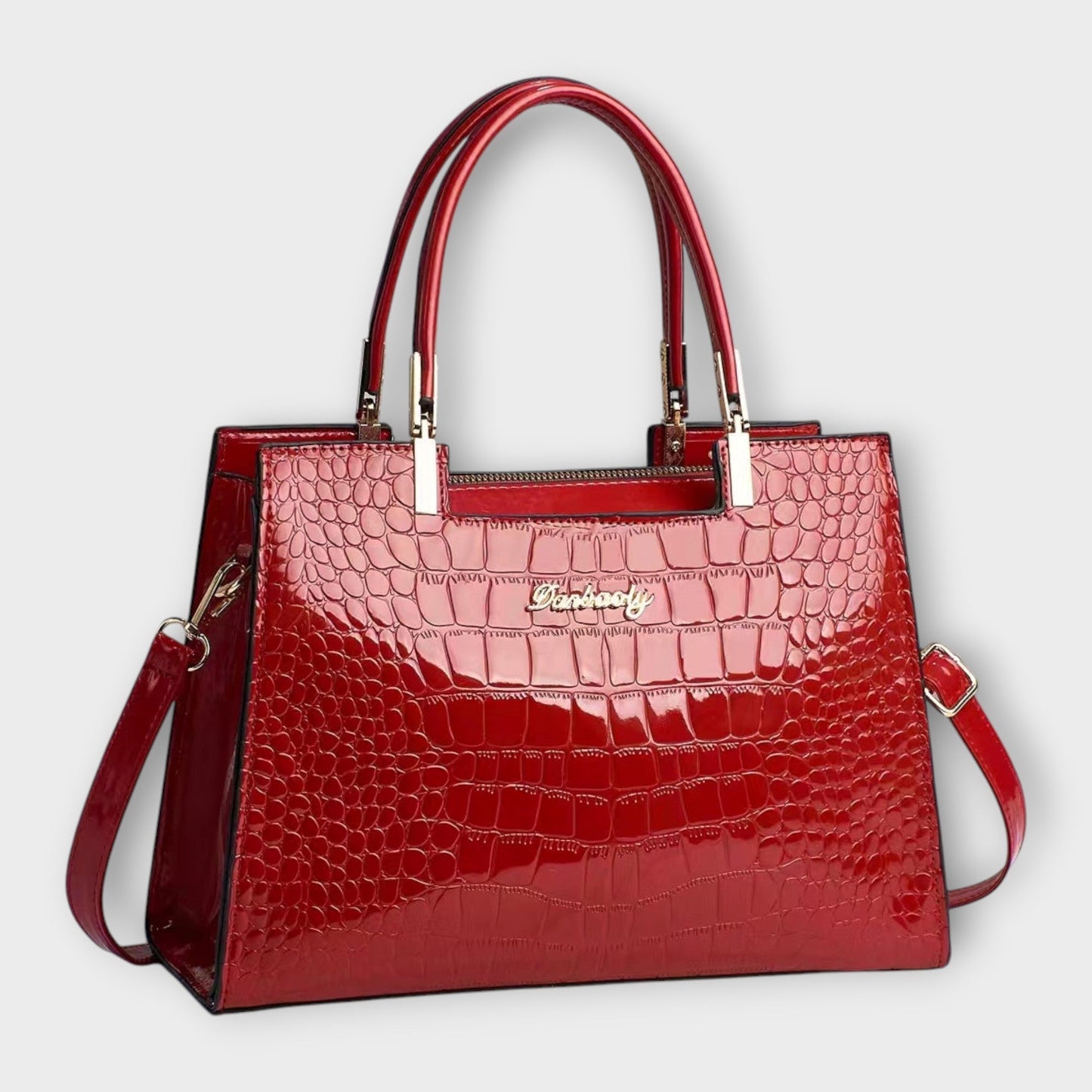 Bolso de mano brillante con estampado de piel de cocodrilo de Laura