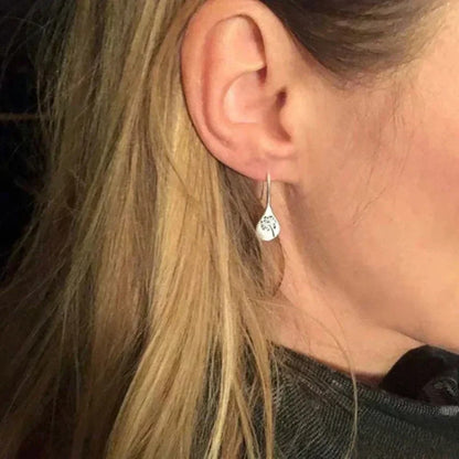Pendientes Dandy León diseñados en color plata