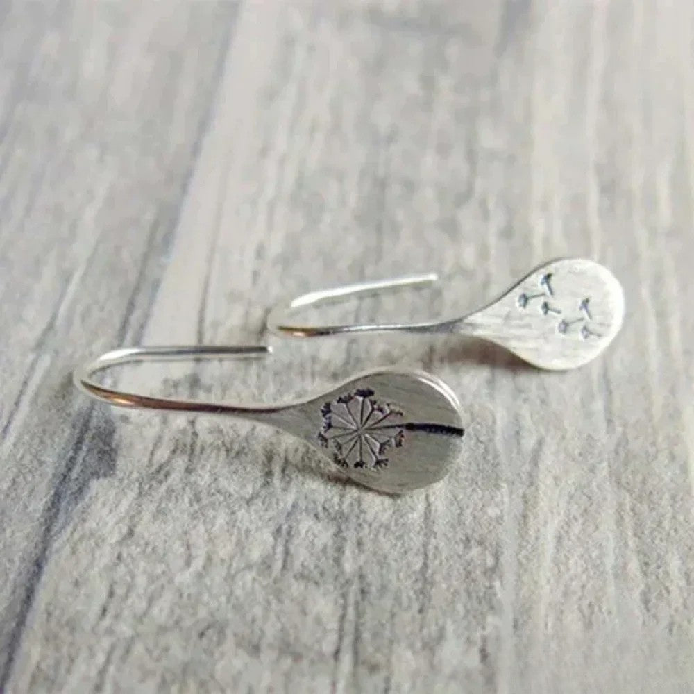 Pendientes Dandy León diseñados en color plata