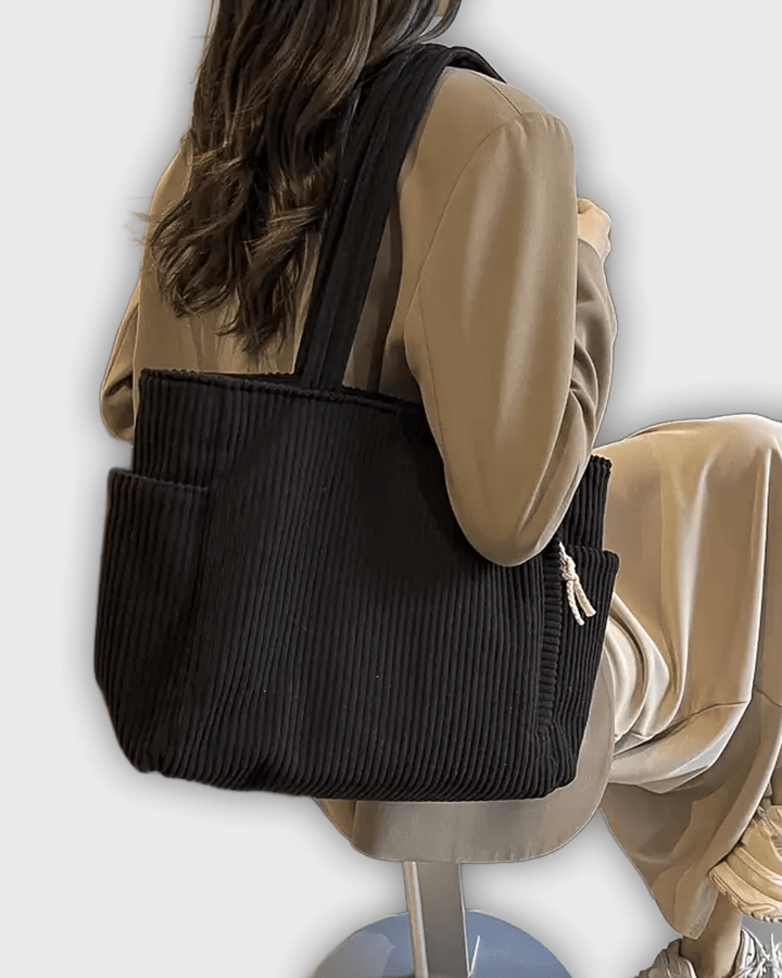 Bolso de mano con detalles de hilo
