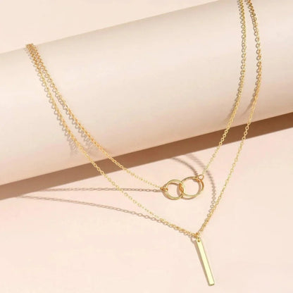 Collar de oro retro con un par de círculos dobles