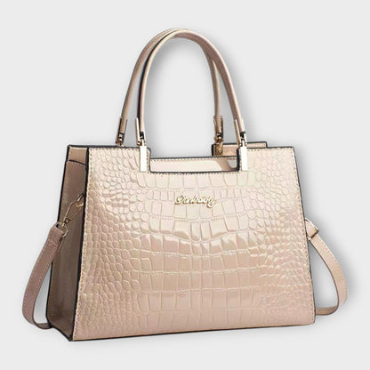 Bolso de mano brillante con estampado de piel de cocodrilo de Laura