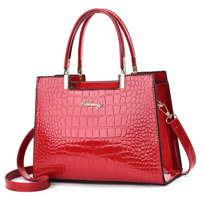 Bolso de mano brillante con estampado de piel de cocodrilo de Laura